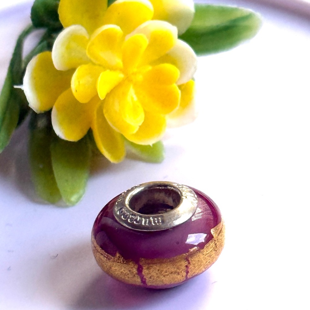 Murano Glass Charm With 925 Silver Core.
Pink and Gold